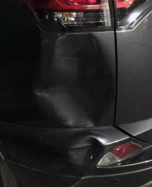 Severely damaged fender on automobile get's dent removed by PDR technique